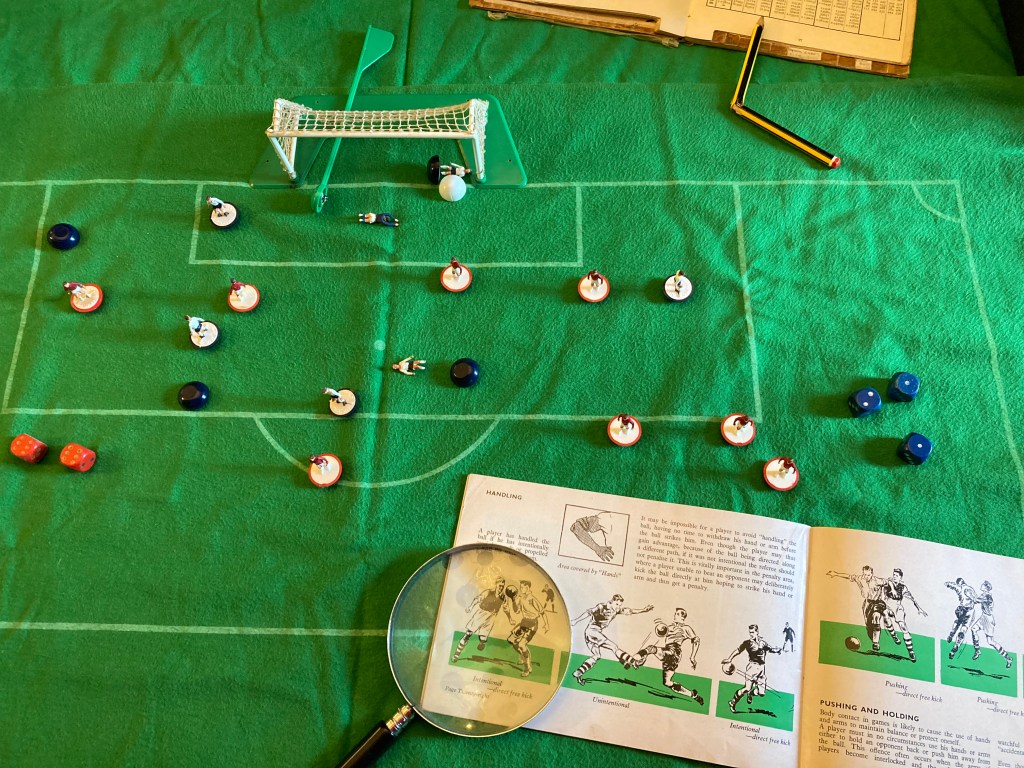 Subbuteo players showing handball