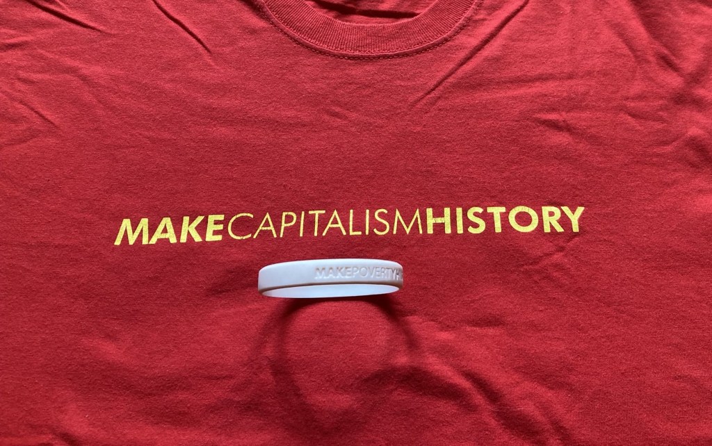 Make Capitalism History T-shirt and Make Poverty History wristband.