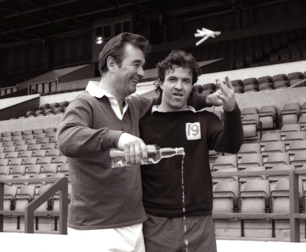 Clough & Taylor throwing away cigarettes and alcohol in Nottingham Forest photo shoot.